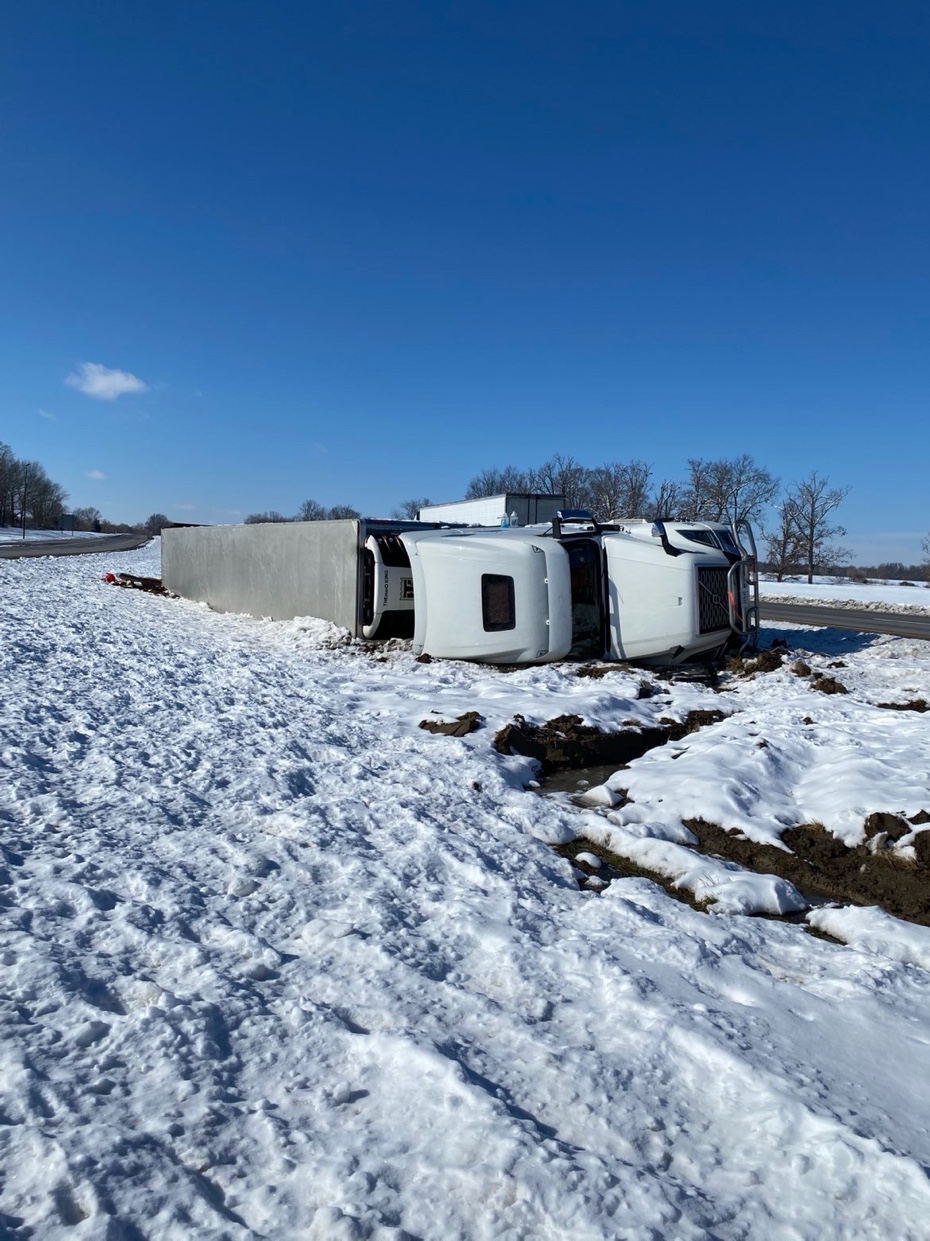 Semi rollover — winter accident scene